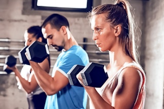 Lifestyle image of a group of people using Cap Barbells