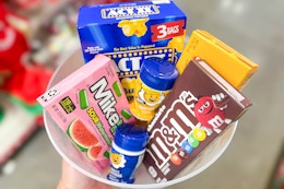 hand holding a bowl of dollar general movie night groceries