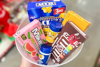 hand holding a bowl of dollar general movie night groceries