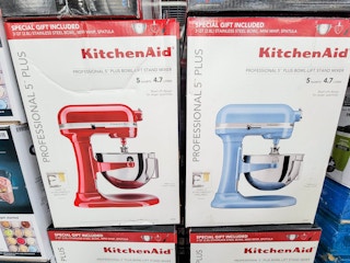 a red and a blue kitchenaid pro mixer