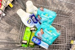 all detergent, crest toothpaste, pampers wipes, garnier shampoo in a cart