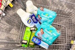 all detergent, crest toothpaste, pampers wipes, garnier shampoo in a cart