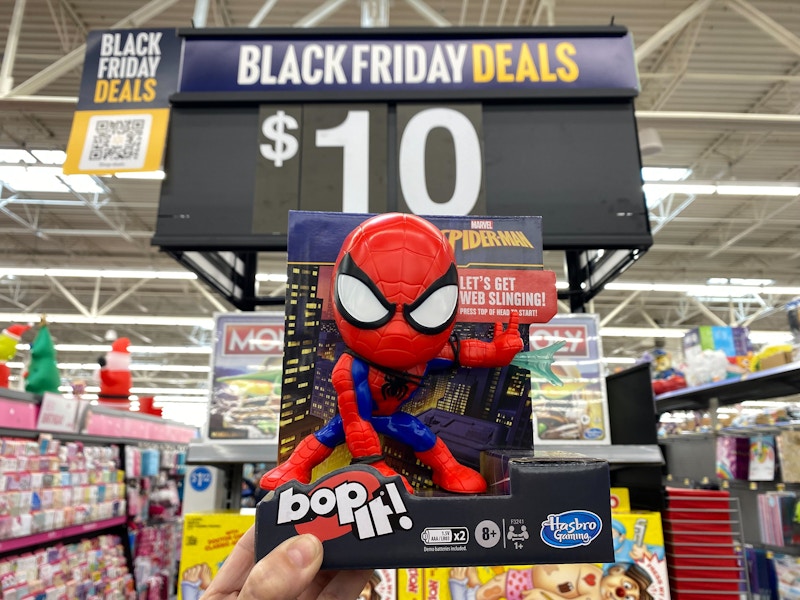 hand holding spiderman bop it game at walmart