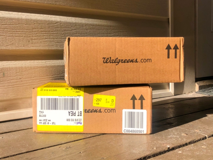 Two Walgreens boxes on front doorstep