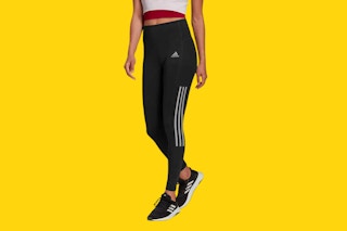 costco adidas ladies active tight on a model only showing her legs and torso in a yellow background