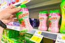 hand holding a bottle of gain tango scent booster at dollar general