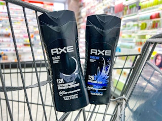 two bottles of body wash sitting in shopping cart in store beauty aisle