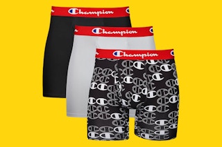 Three pairs of Champion boxer briefs - two solid colors and one pattern - on a yellow background