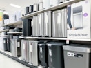 trash cans sitting on a target shelf
