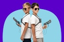 Two kids holding laser tag guns from Hero Squads playset