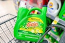 large jug of gain detergent in a cart