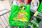 large jug of gain detergent in a cart
