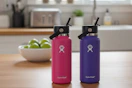two 32-ounce hydro flask bottles
