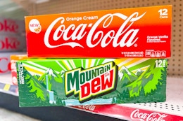 coca-cola and mountain dew 12-packs stacked on store shelf