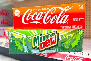 coca-cola and mountain dew 12-packs stacked on store shelf