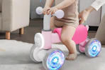 a toddler on a light-up balance bike