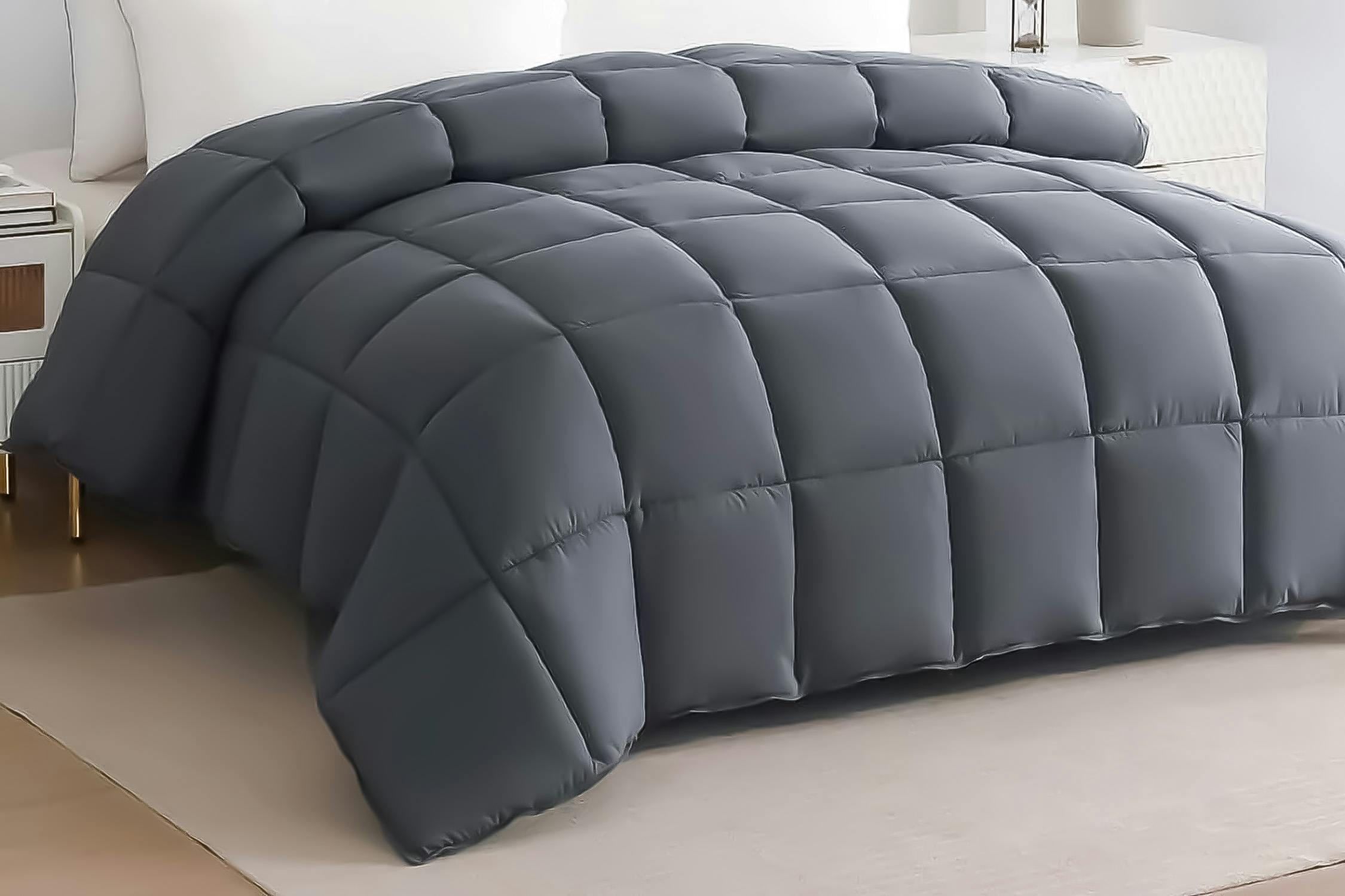 Lifestyle image of grey quilted Down Alternative Comforter on bed in bedroom