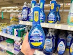 hand holding dawn dish spray in walgreens