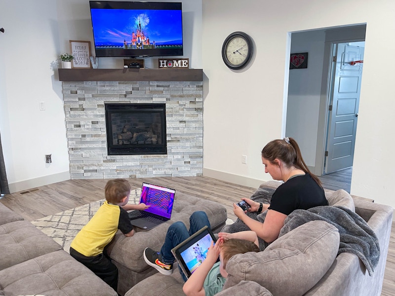 family watching disney plus on multiple screens