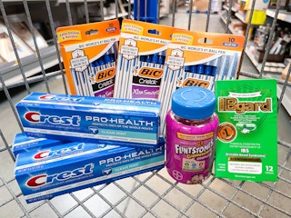 Crest, Flinstones Vitamins, IBgard, and BIC products in Walmart shopping cart