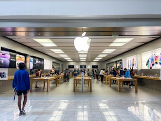 Outside apple store with lots of people inside