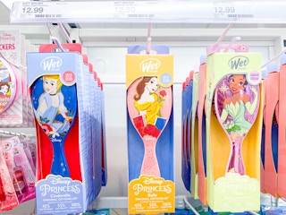 disney princess wet brushes hanging on shelf at target