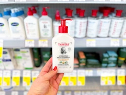hand holding thayers hydrating milky cleanser in walgreens
