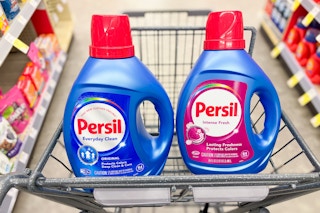 2 large bottles of persil detergent in a cart