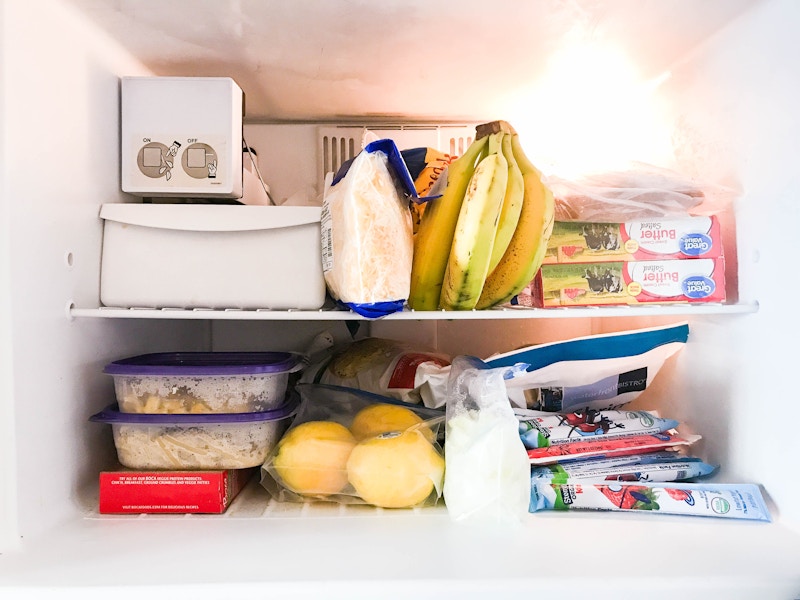 Inside a freezer filled with food.