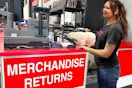 a person standing in front of return counter in costco