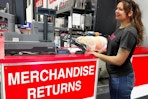 a person standing in front of return counter in costco