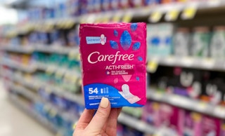 hand holding a pack of carefree liners