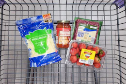 shredded cheese, pizza sauce, strawberries, and ground beef in a cart