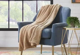 tan/beige teddy bear throw blanket on a chair
