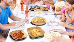 a table with food in air fryer liners