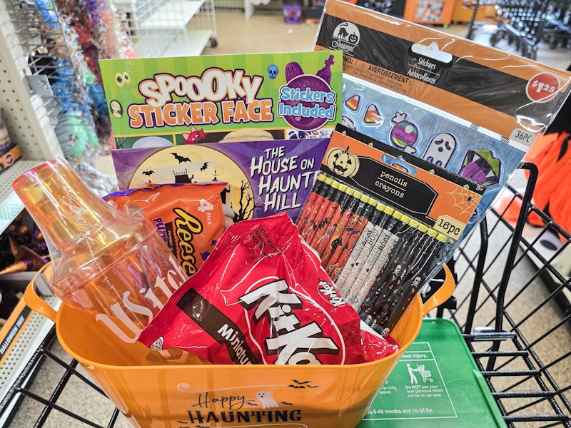 halloween basket with candy, stickers, coloring books and more