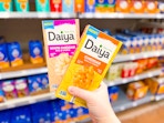 2 Daiya Mac & Cheese boxes held up in pasta aisle at Walmart
