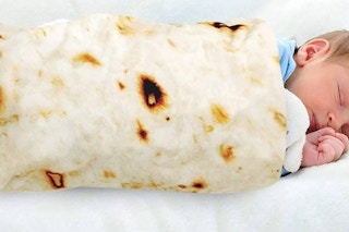 a baby wrapped in a tortilla blanket