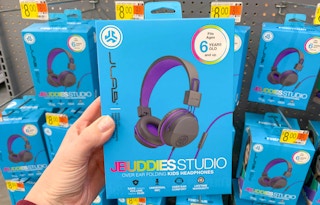 hand holding box of jlab jbuddies studio headphones