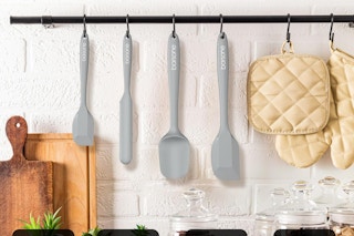 grey spatula set hanging up