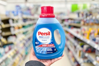 hand holding persil detergent