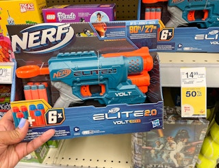 hand holding Nerf elite toy next to sales tag