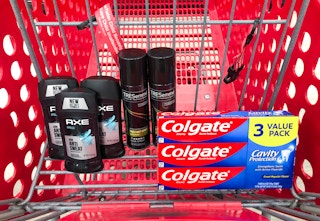 Axe deodorant, Colgate toothpaste 3 pack and two bottles of Tresemme hair spray in Target shopping cart