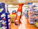 Febreze air freshener spray (pumpkin roll scent) held up in Walmart store