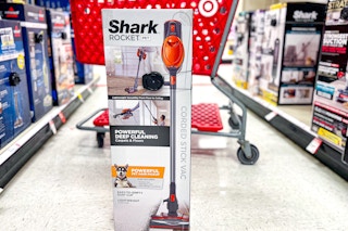 shark rocket stick vacuum sitting in front of a target cart
