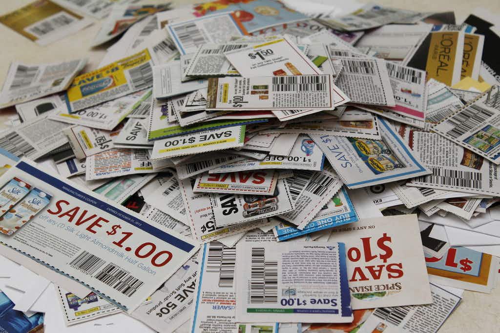 a pile of paper coupons