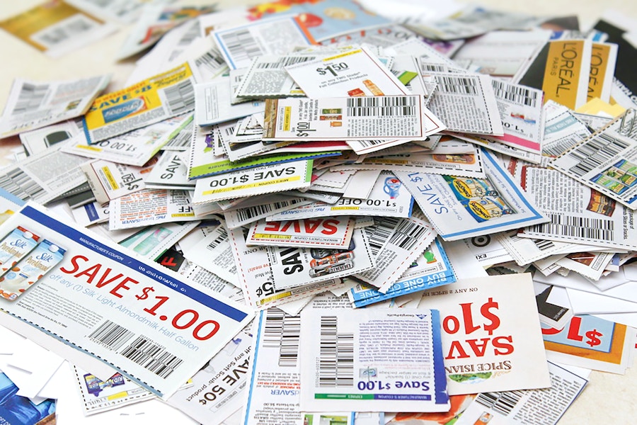 a pile of paper coupons