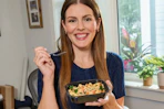 a woman eating jenny craig meals