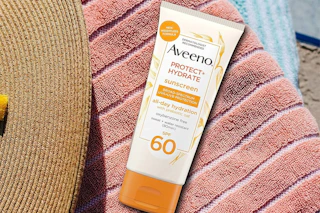 a bottle of aveeno sunscreen lotion