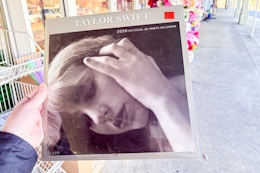 hand holding taylor swift calendar